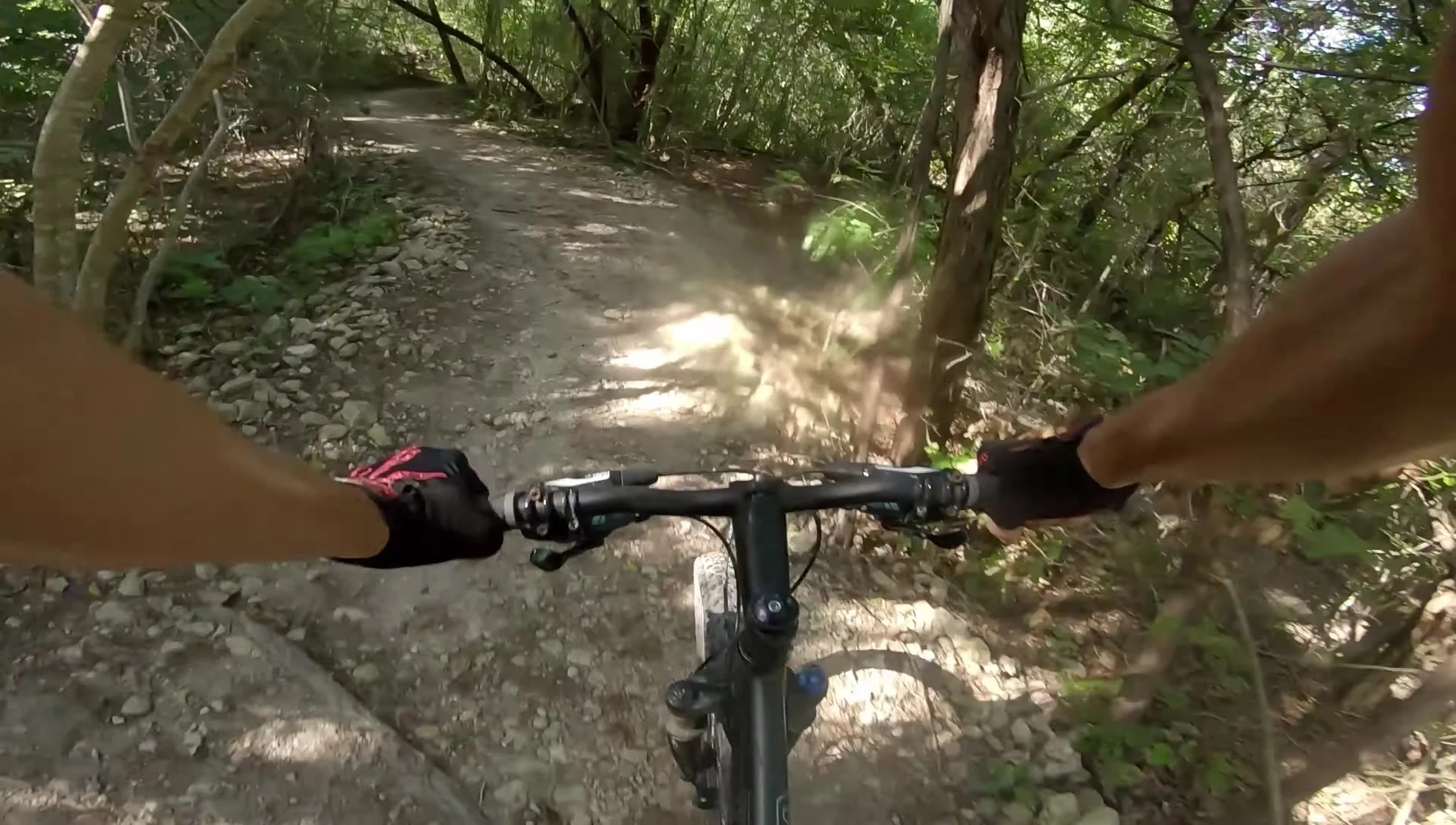 The speaker is riding a bike with the Fooker pedals installed