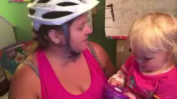 The reviewer demonstrating the use of the mirror while cycling